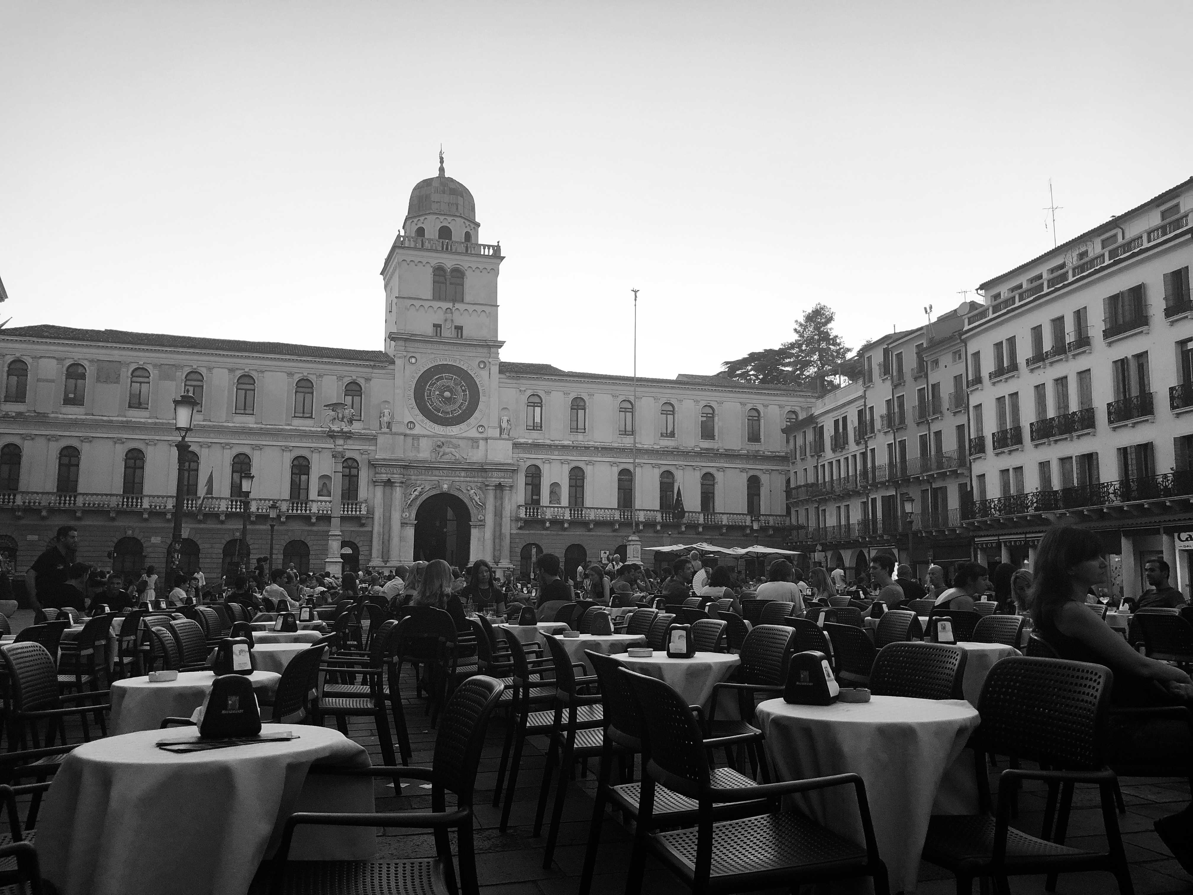 European piazza scene reinforcing the premium, considered atmosphere behind the Brand Elevation positioning.
